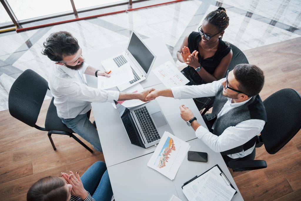 Young Employees Sitting Office Table Using Laptop Team Work Brainstorming Meeting Concept 1024x683